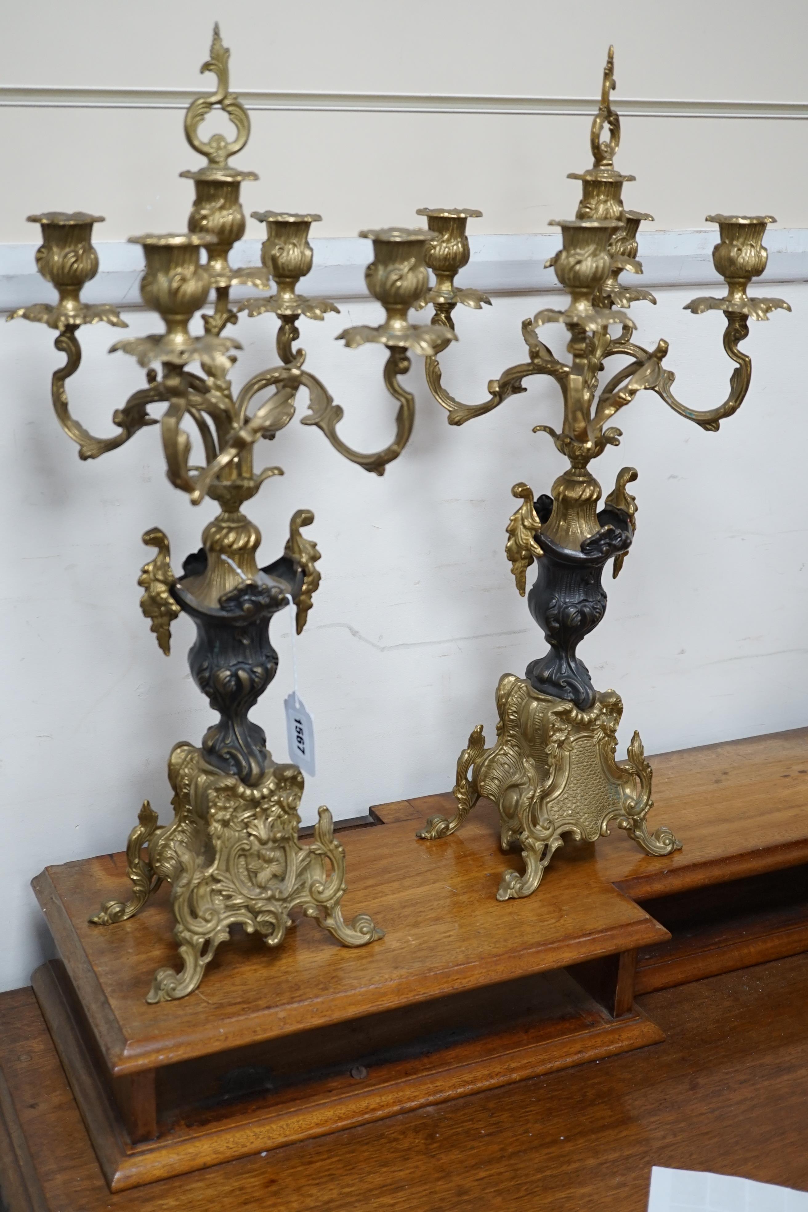 A pair of French brass five light candelabra, 58cm high